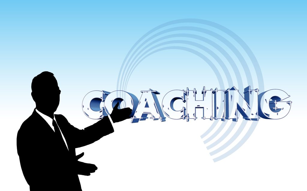 Diagram of a man posting to the word "Coaching"