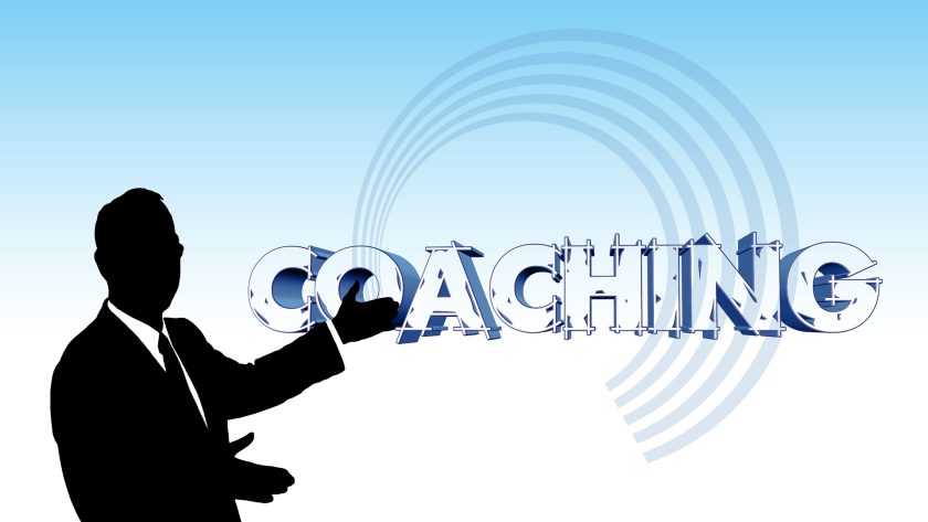 Diagram of a man posting to the word "Coaching"