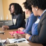 3 African American woman are sitting and talking