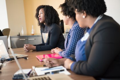 3 African American woman are sitting and talking