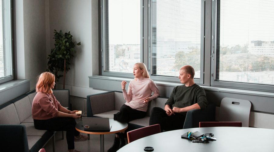 A group, of people are sitting and talking